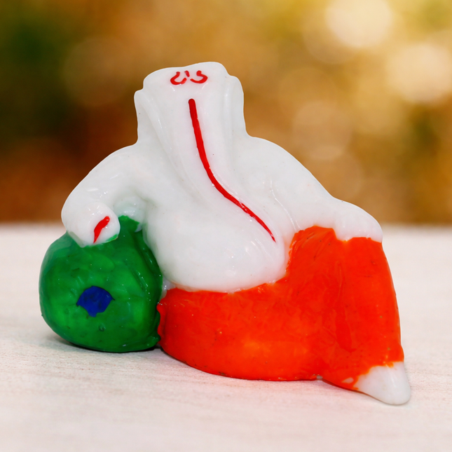 Handcrafted White Resin Seated Ganesha Idol in Orange Dhoti