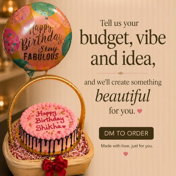 A birthday cake and balloon gift arrangement displayed in a basket on a beige background with promotional text. The basket contains a round pink frosted cake with black drip details and a red bow, next to a colorful balloon that reads 'Happy Birthday Stay FABULOUS'.
